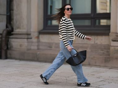 woman walking wearing sneakers