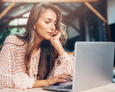 woman googling computer cafe