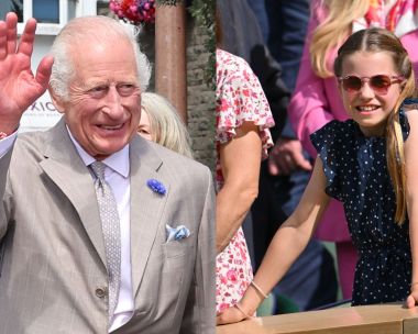 King Charles waves in a gray suit, wearing a friendship bracelet like the one Princess Charlotte wears at Wimbledon