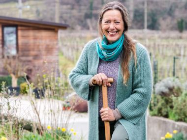 Woman gardening in warm winter clothes