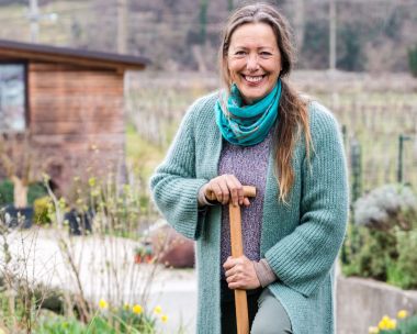 Woman gardening in warm winter clothes