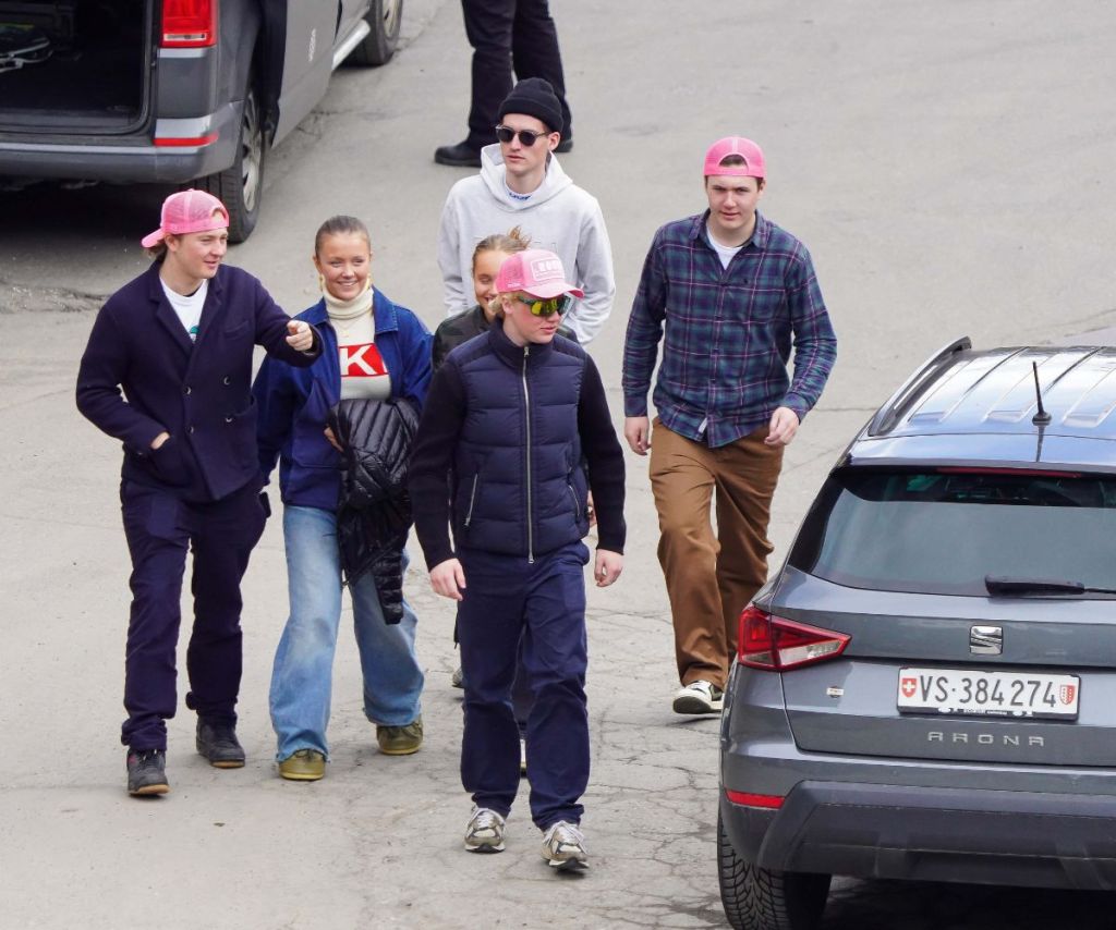 Royal Danish children wearing casual clothes with some in pink ball caps