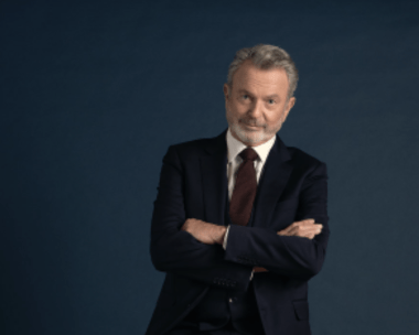 Why screen legend Sam Neill loved reprising legal eagle Brett Colby in The Twelve